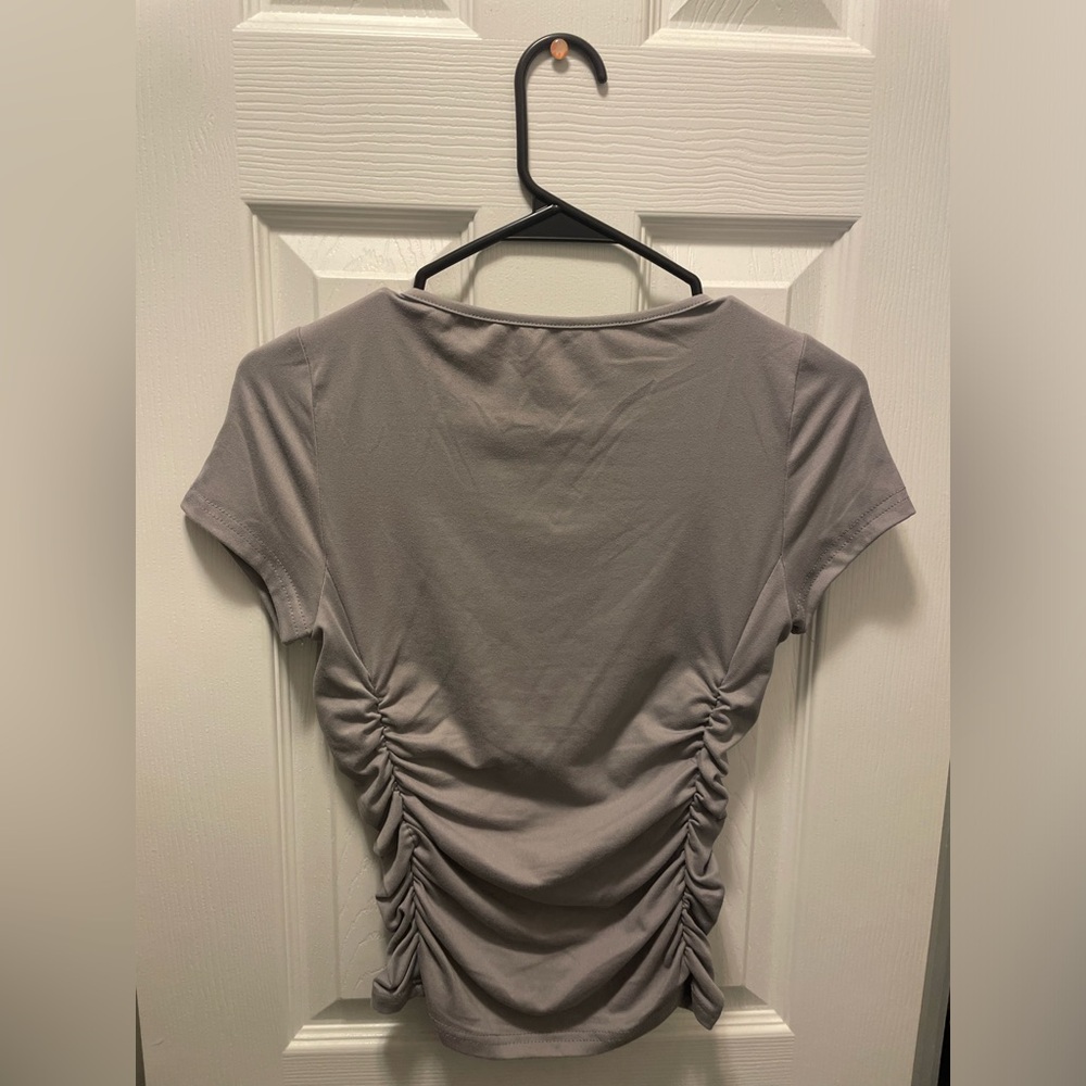 Grey top with cinch detail
super cute and fitting 
slightly cropped